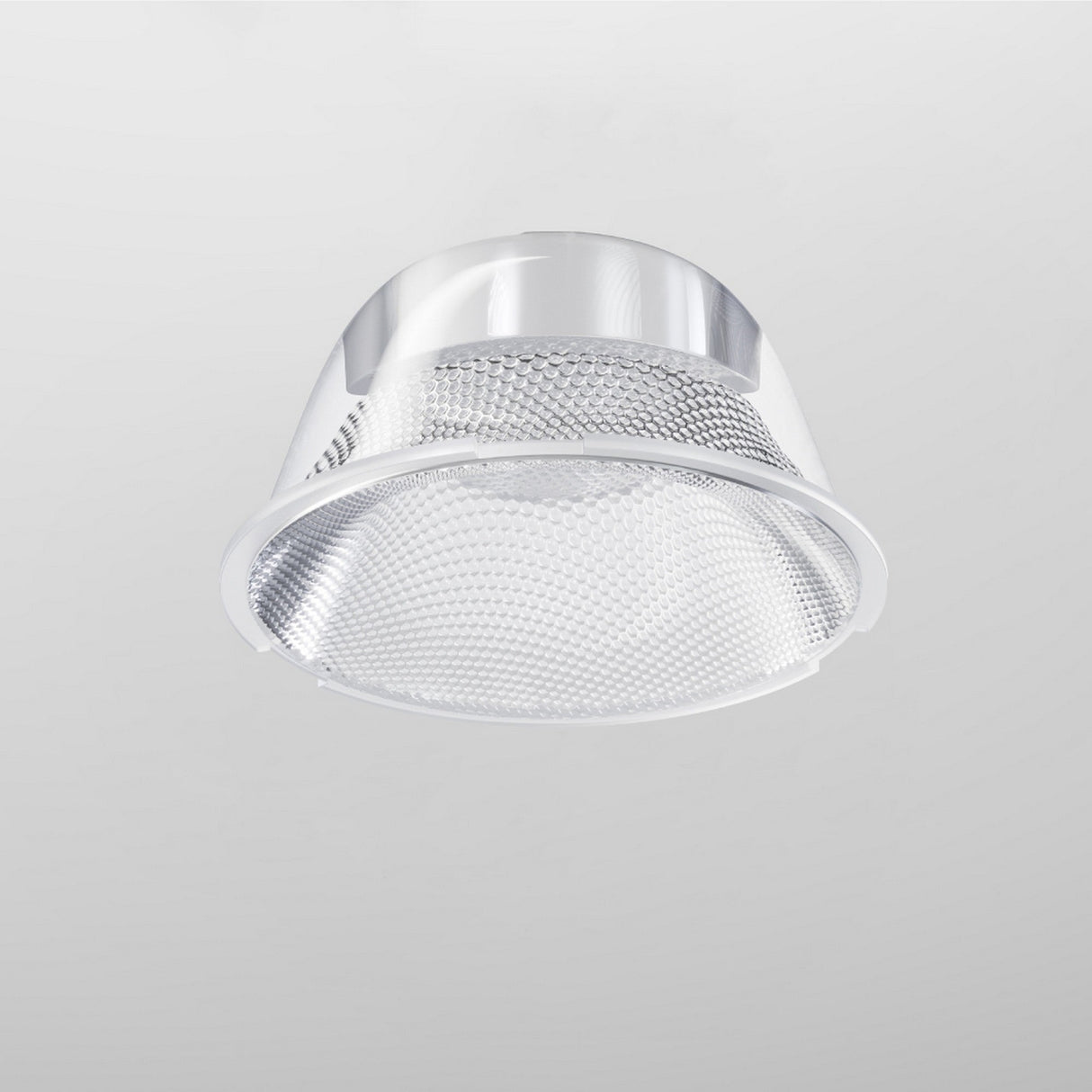 The Focus LED Track Light Lens ⌀55mm 50° is a modern, silver recessed ceiling light with a textured, reflective surface and ambient lighting. It features a smooth edge, circular design, and offers a sophisticated 50° beam angle for enhanced illumination against a plain gray background.