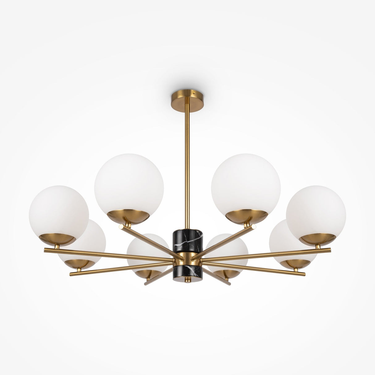 A contemporary chandelier with a central black rod and six brass arms, featuring opal glass shades. This elegant fixture, suspended from the ceiling, evokes the modern design of the Marble 8 Light Chandelier - Brass.