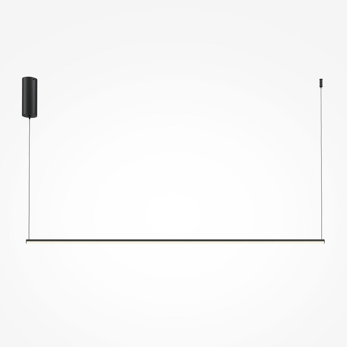 The Halo Dimmable LED Long Linear Suspension Light 3000-4000K - Black features a minimalist design with a slim horizontal rod in black aluminum, suspended by two cables. The left cable attaches to a cylindrical ceiling mount, while the right connects to a smaller fixture.