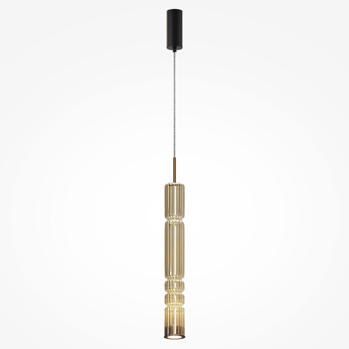 The Ordo LED Long Pendant Light features a gold vertically ribbed design with a cognac cylindrical glass shade and black ceiling mount, showcasing an elegant ridged structure that houses an energy-efficient LED light for a contemporary look.