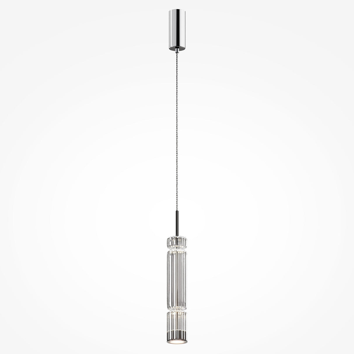 The Ordo LED Short Pendant Light, featuring a sleek chrome finish and a vertically ridged clear cylindrical glass shade, elegantly hangs from the ceiling. A thin wire suspends it from a round ceiling mount, showcasing its modern design.