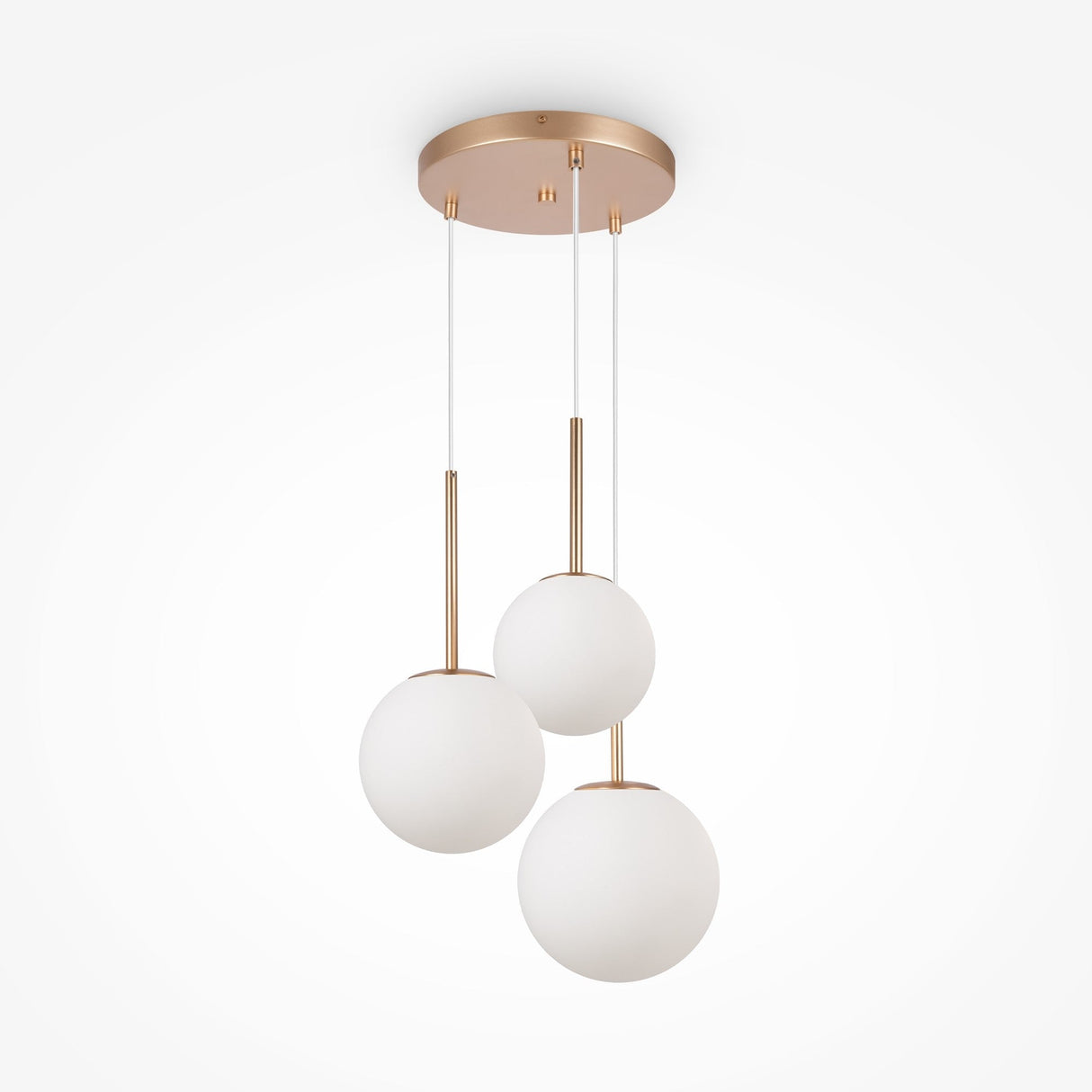 The Basic Form 3 Light Cluster Pendant features a modern gold finish, three spherical white opal glass lamps, and a sleek round base. Each shade is suspended by thin gold rods and wires, creating a contemporary look against a white backdrop.