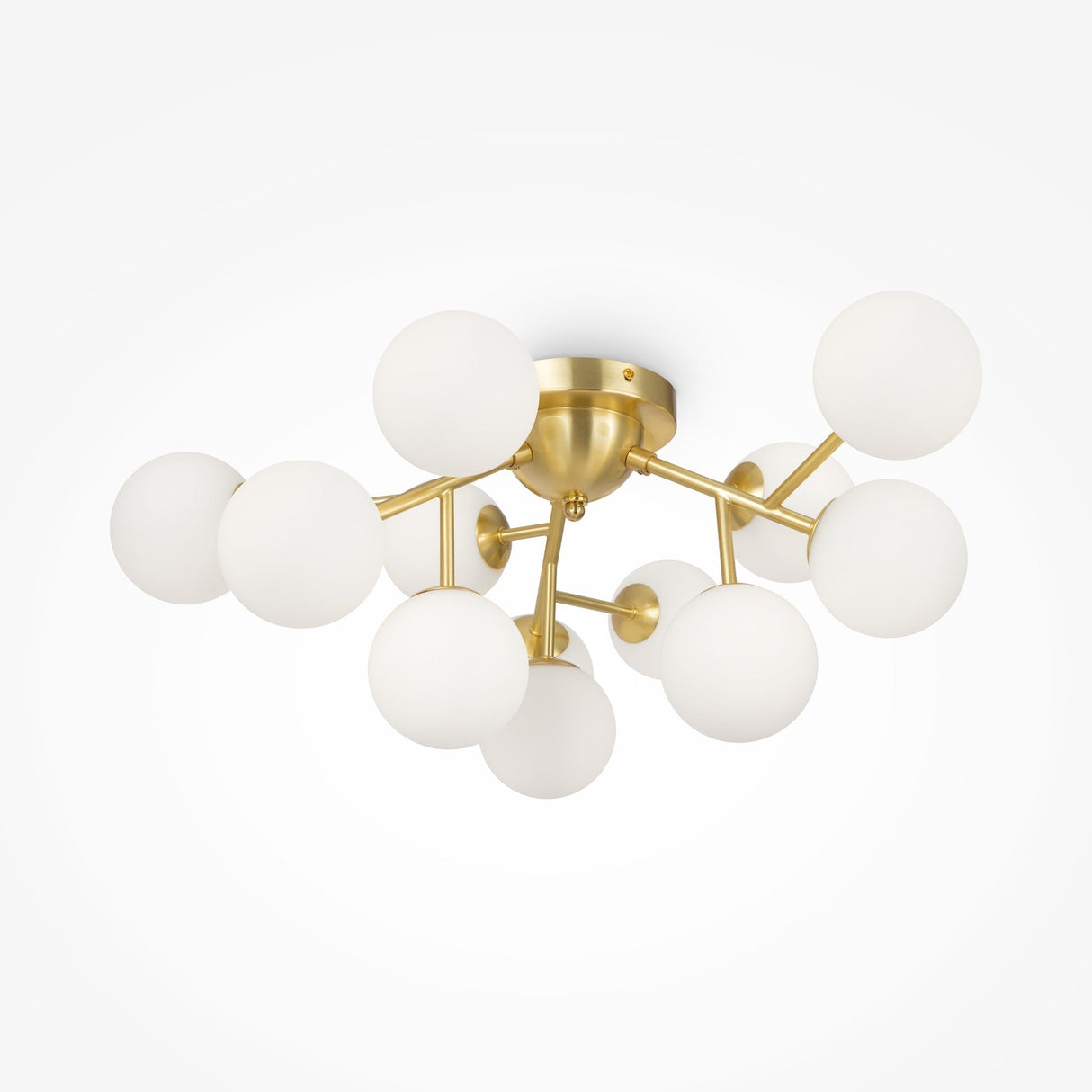 A contemporary chandelier featuring a brass base and several white glass globes, similar to the Dallas 12 Light Semi-Flush - Brass With White Glass, enhances the space with elegant modern lighting when mounted on a white ceiling.