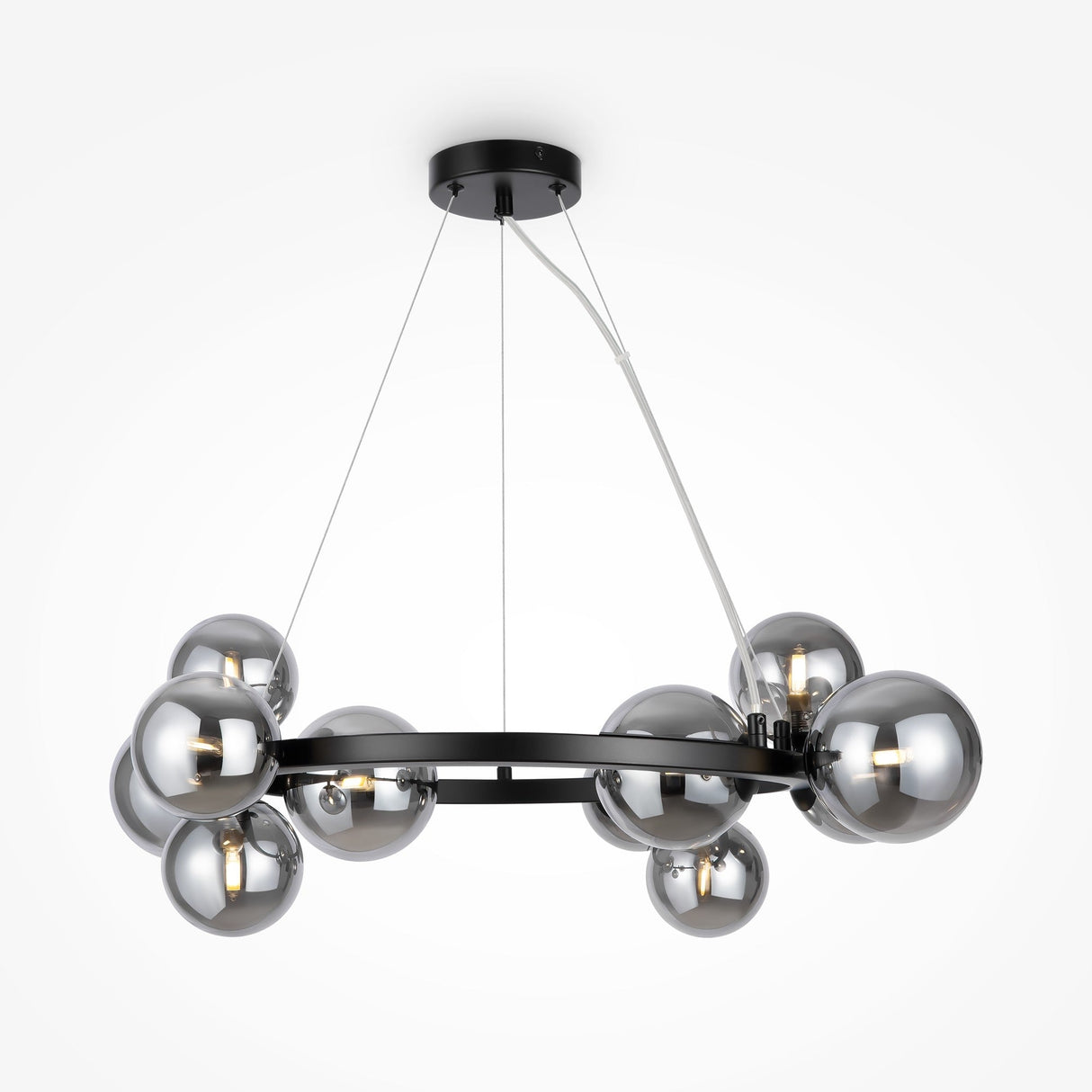The Dallas 11 Light Suspension features a modern black circular frame with twelve metallic spheres made of smoked glass. This stylish chandelier, perfect for contemporary interiors, has reflective shades elegantly hanging from thin wires attached to a black ceiling mount.