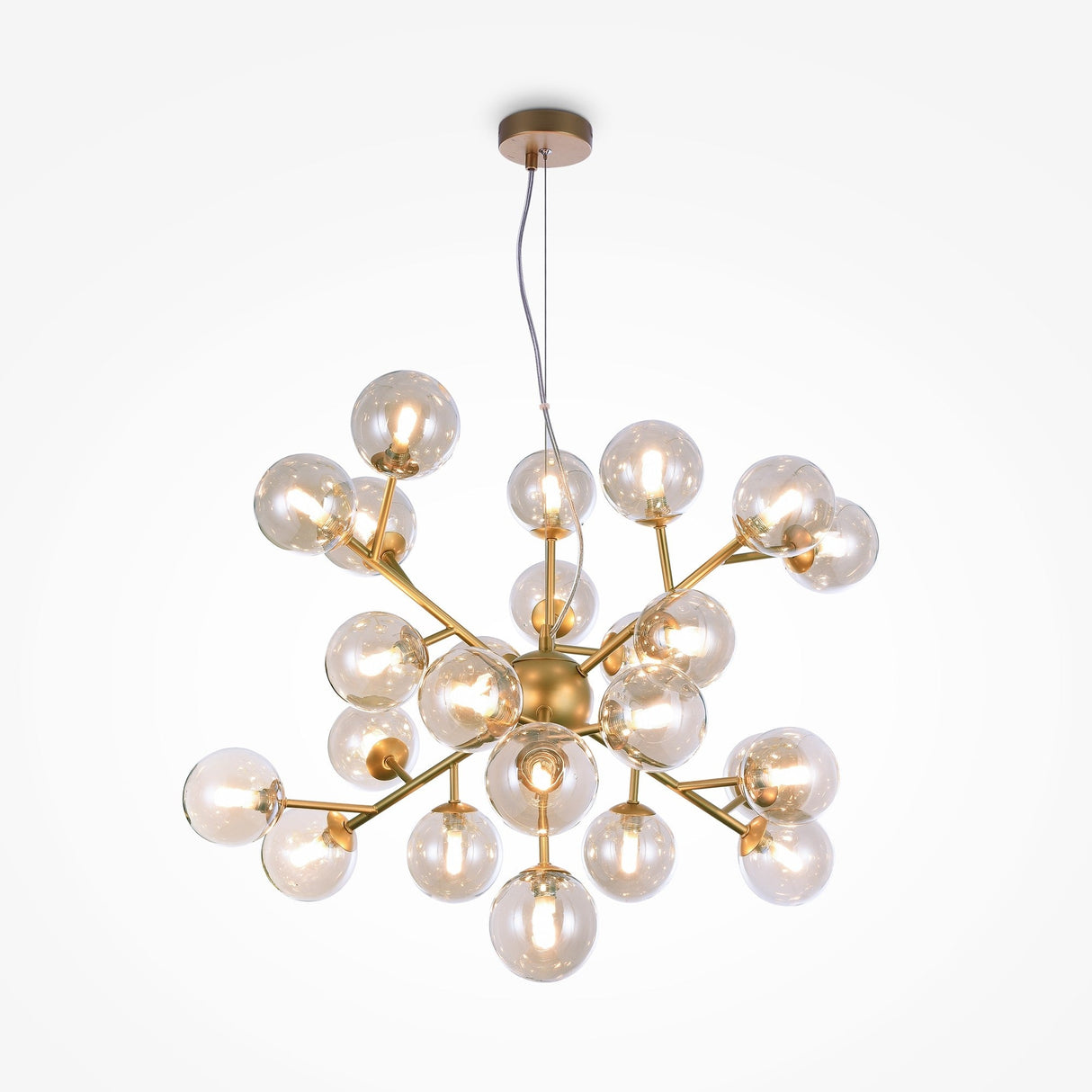 The Dallas 24 Light Chandelier features a modern spherical design with gold-colored metal rods and transparent amber glass globes. This centerpiece is elegantly suspended by a wire, adding sophistication to any space.