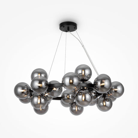The Dallas 25 Light Suspension is a sleek modern design with multiple smoky glass globes on thin metal cables, suspended from a circular black ceiling mount, each globe housing a bulb.