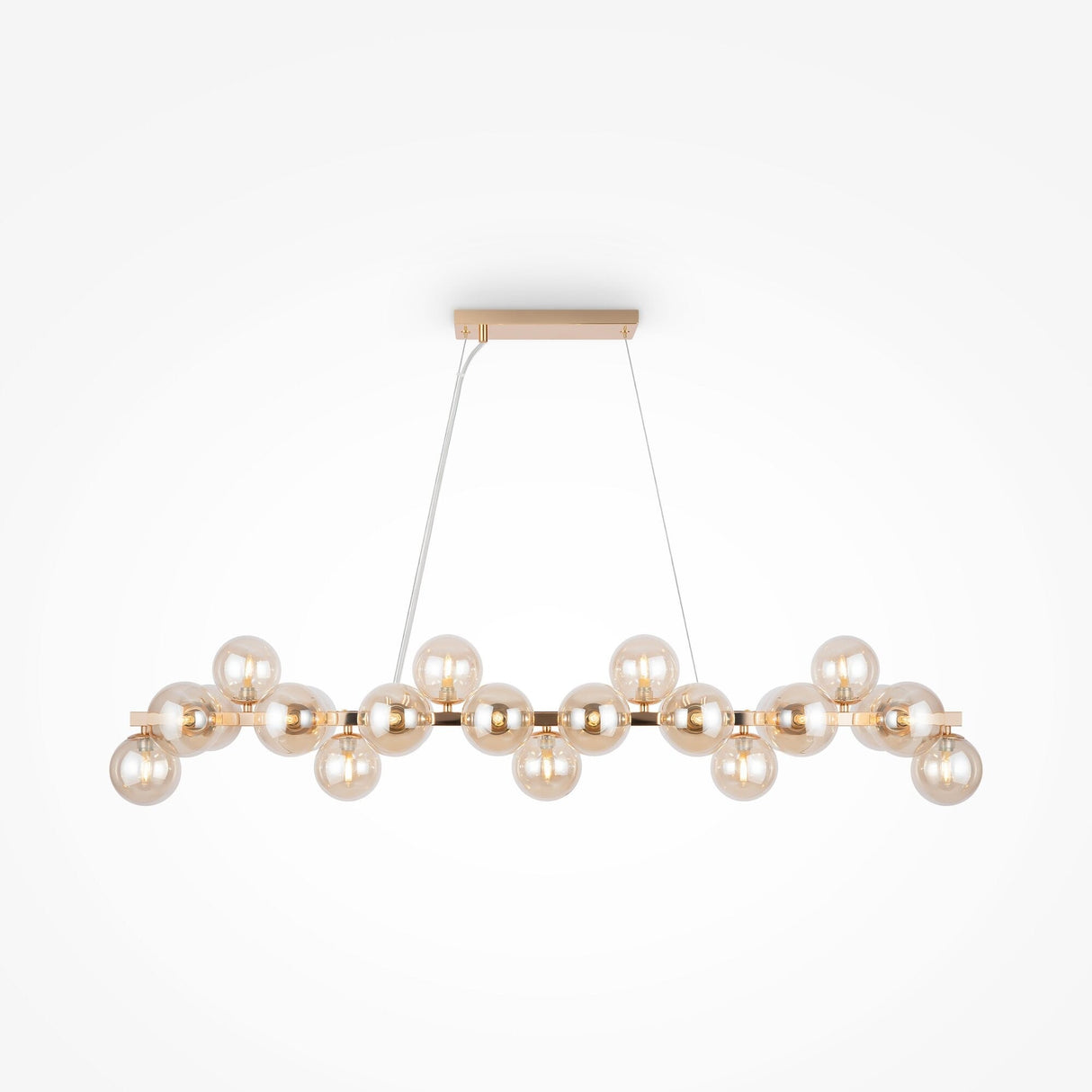 The Dallas 25 Light Linear Suspension in Gold with Amber Glass is a luxury fixture with a rectangular base and two cords, featuring round bulbs in a horizontal arrangement that provide a warm, contemporary glow against plain backgrounds.