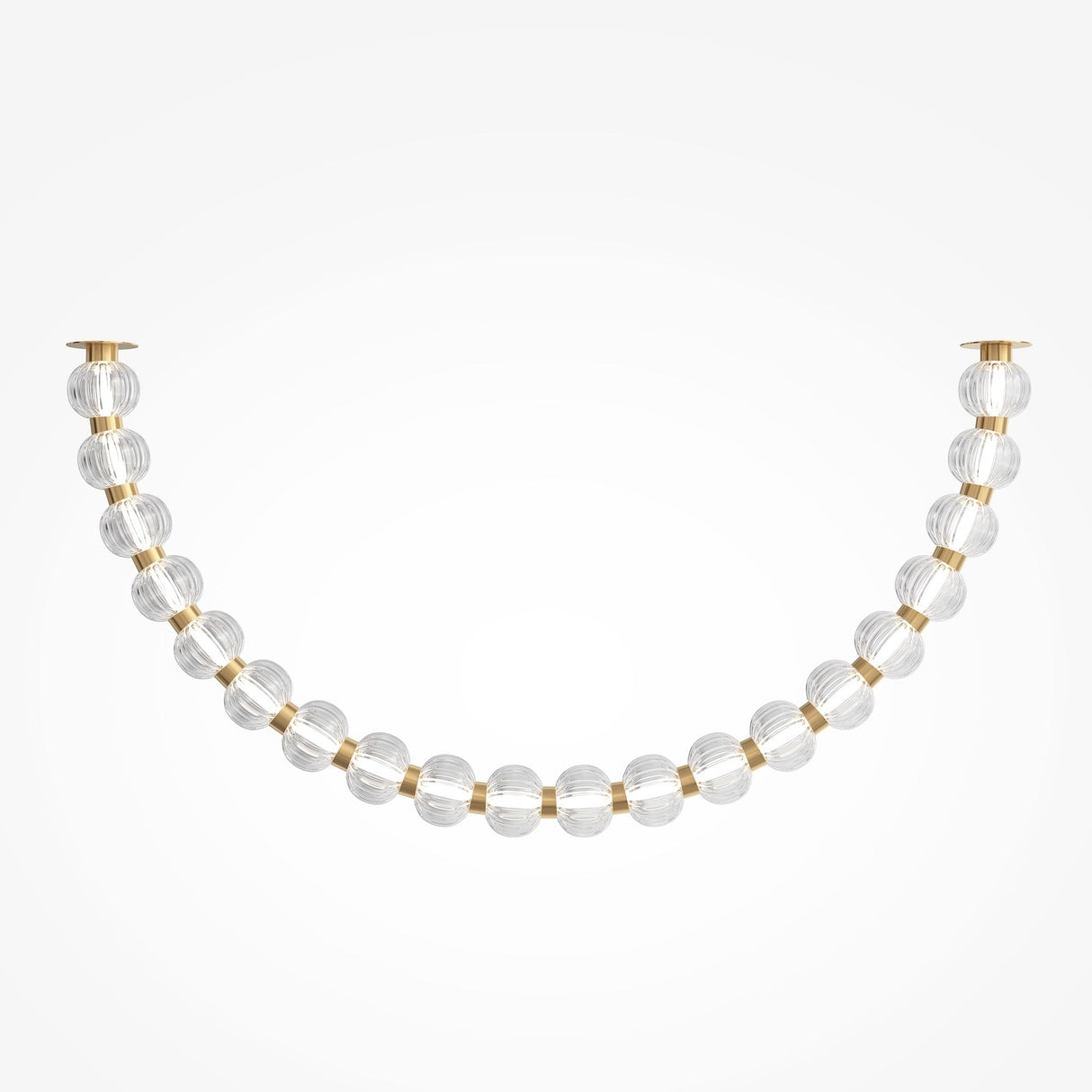 A decorative strand, the Amulet LED Ceiling Light features ribbed glass spheres and smaller golden beads arranged in a gentle U-shape against a plain background.