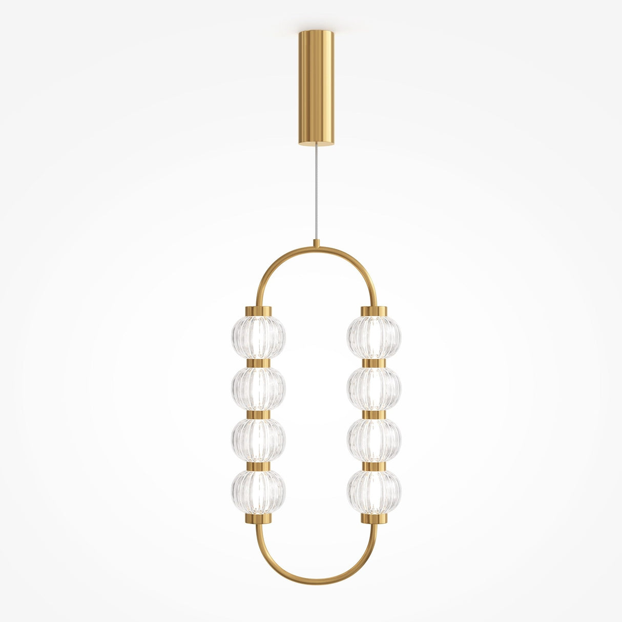 The Amulet LED Pendant features an oval gold frame with eight ribbed glass spheres, suspended from a short gold rod attached to the ceiling.