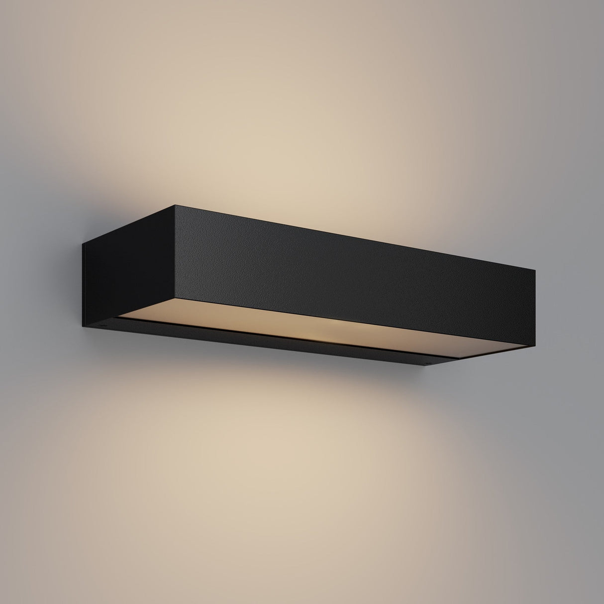 The Lot Outdoor LED Wall Light 20W 3000K in Graphite features a modern rectangular design, emitting soft up-and-downward light for a gentle glow. Its energy-efficient style is perfect for complementing contemporary decor.