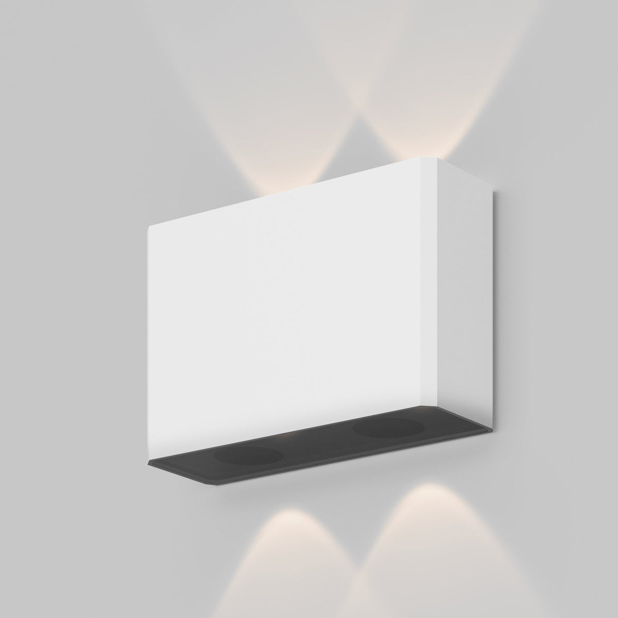 The Show Outdoor Wall Light 3000K in white features a minimalist design with an energy-efficient LED. It emits soft light up and down, creating a patterned illumination on the light grey wall for sleek, modern functionality.