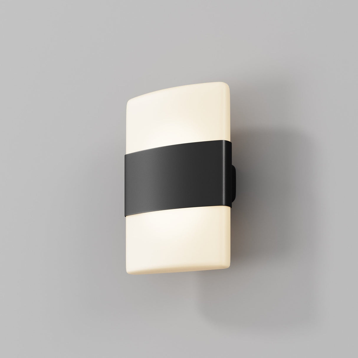 The Rom Outdoor LED Up & Down Wall Light - Graphite features a modern rectangular, cream-colored body with a bold black horizontal band. Its IP54 rating makes it perfect for any setting, enhanced when set against a plain gray background for added elegance.