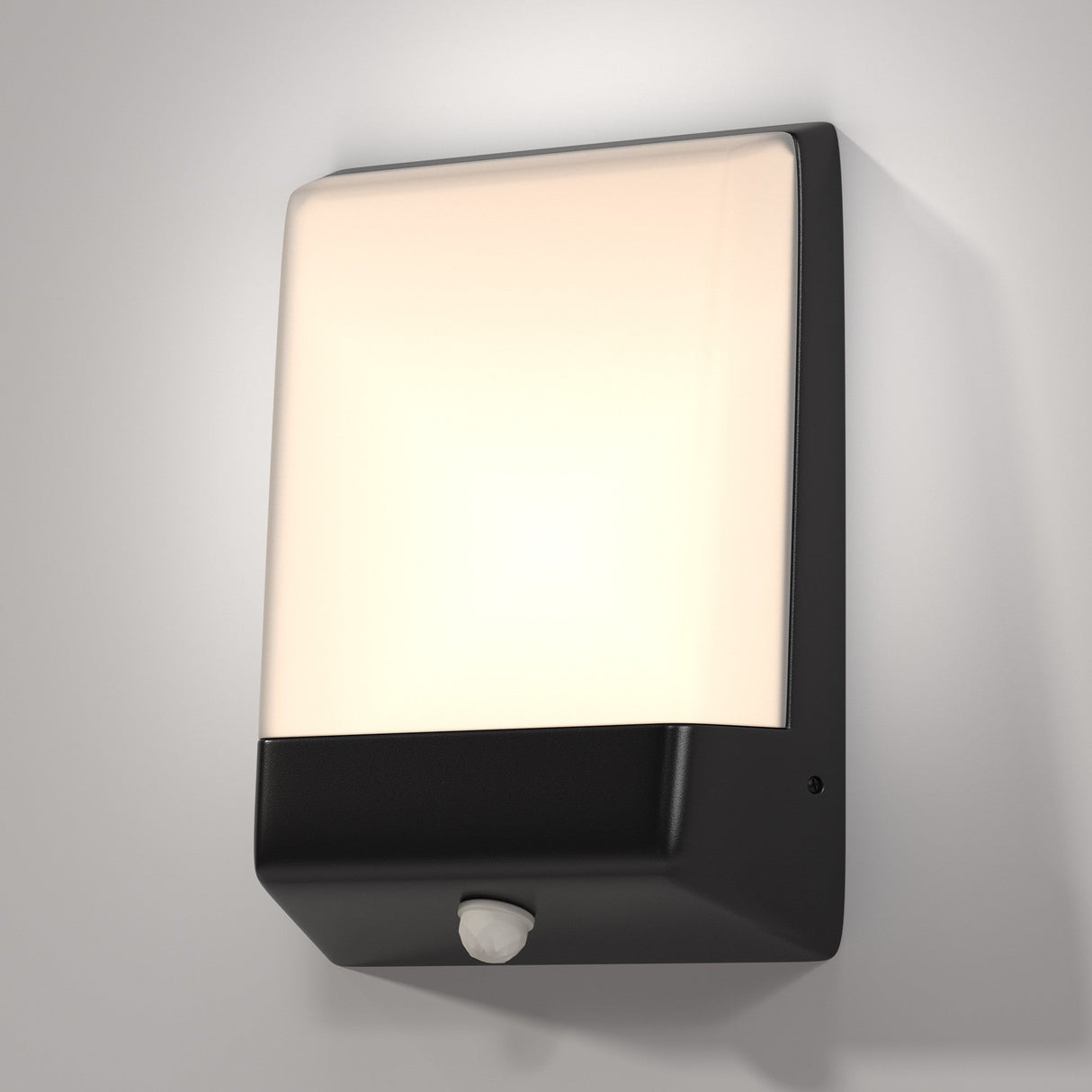 The Row LED Outdoor Wall Light 9W 3000K - Graphite sports a modern rectangular design with a graphite casing. It has an illuminated white panel on top and a black base with a circular sensor, and its IP44 rating makes it ideal for outdoor use against gray backgrounds.