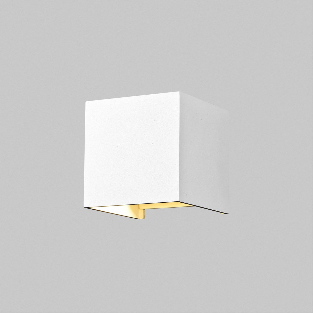 The Fulton Outdoor LED Rectangular Wall Light - White is made from corrosion-resistant aluminum, featuring a minimalist white cube on a grey background. Its energy-efficient LED modules emit a soft glow from the bottom.