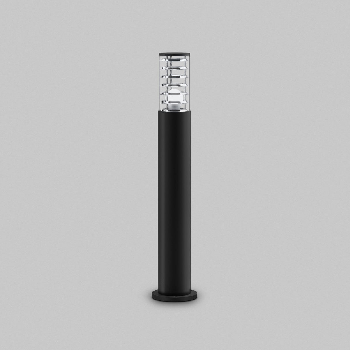 The Bronx Bollard Light 796mm in black, designed with corrosion-resistant aluminum, has a sleek cylindrical body and a clear top section accented with metal on a gray background, showcasing modern outdoor lighting aesthetics.