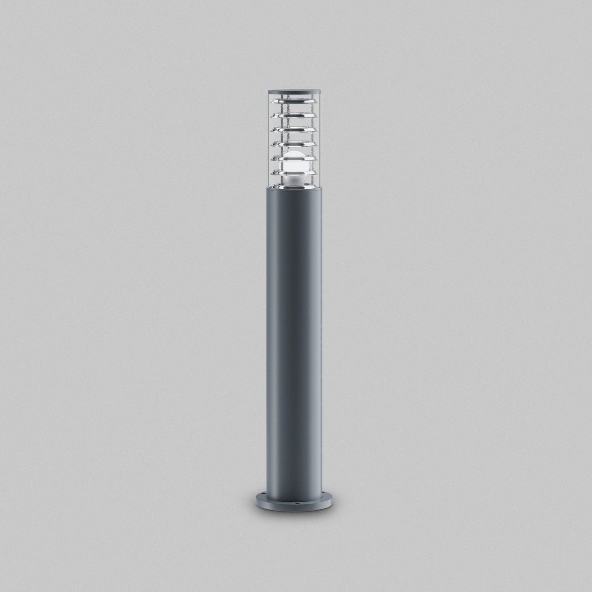 Introducing the Bronx Bollard Light 796mm - Grey, a modern outdoor lighting solution with a sleek, cylindrical design featuring an aluminum body with a transparent cover and flat circular base, all in stylish dark gray against a plain gray background.
