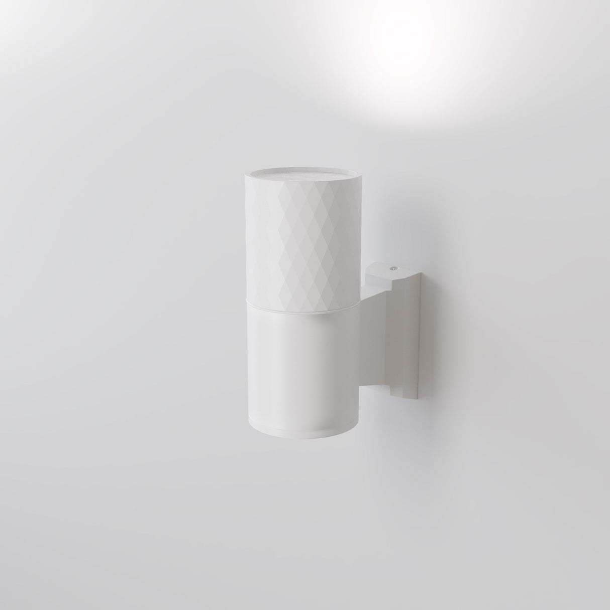 The Bowery Outdoor 1 Light Wall Light (O583WL-02W) in white features a textured cylindrical design and durable metal construction. Casting light upwards with a subtle matching bracket, it embodies an elegant, minimalist, contemporary aesthetic against a plain white wall.