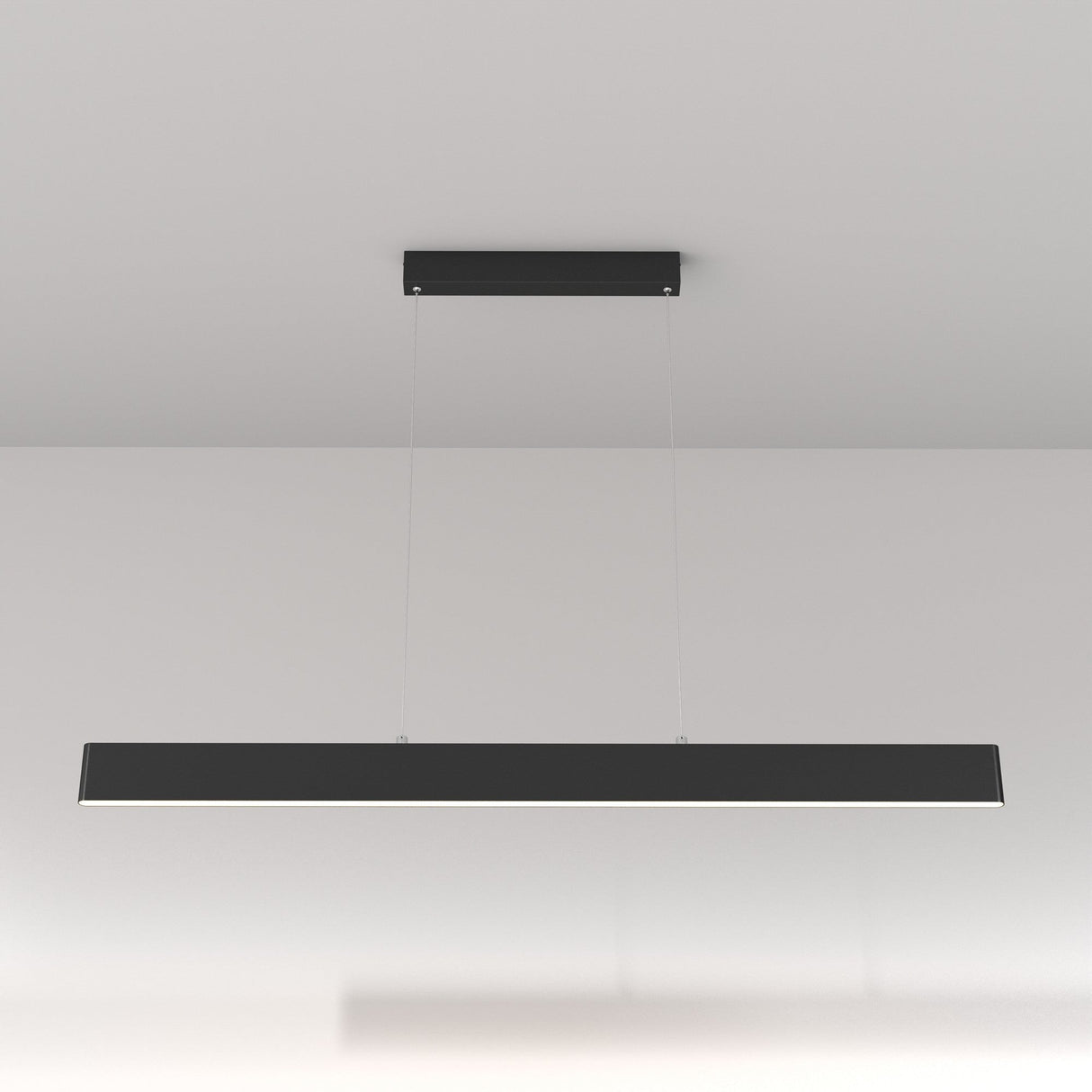 The Step LED Long Linear Suspension Light 4000K 30W in black features a sleek, modern design with suspended thin wires over a white background, utilizing advanced SMD LED technology for superior efficiency and illumination.
