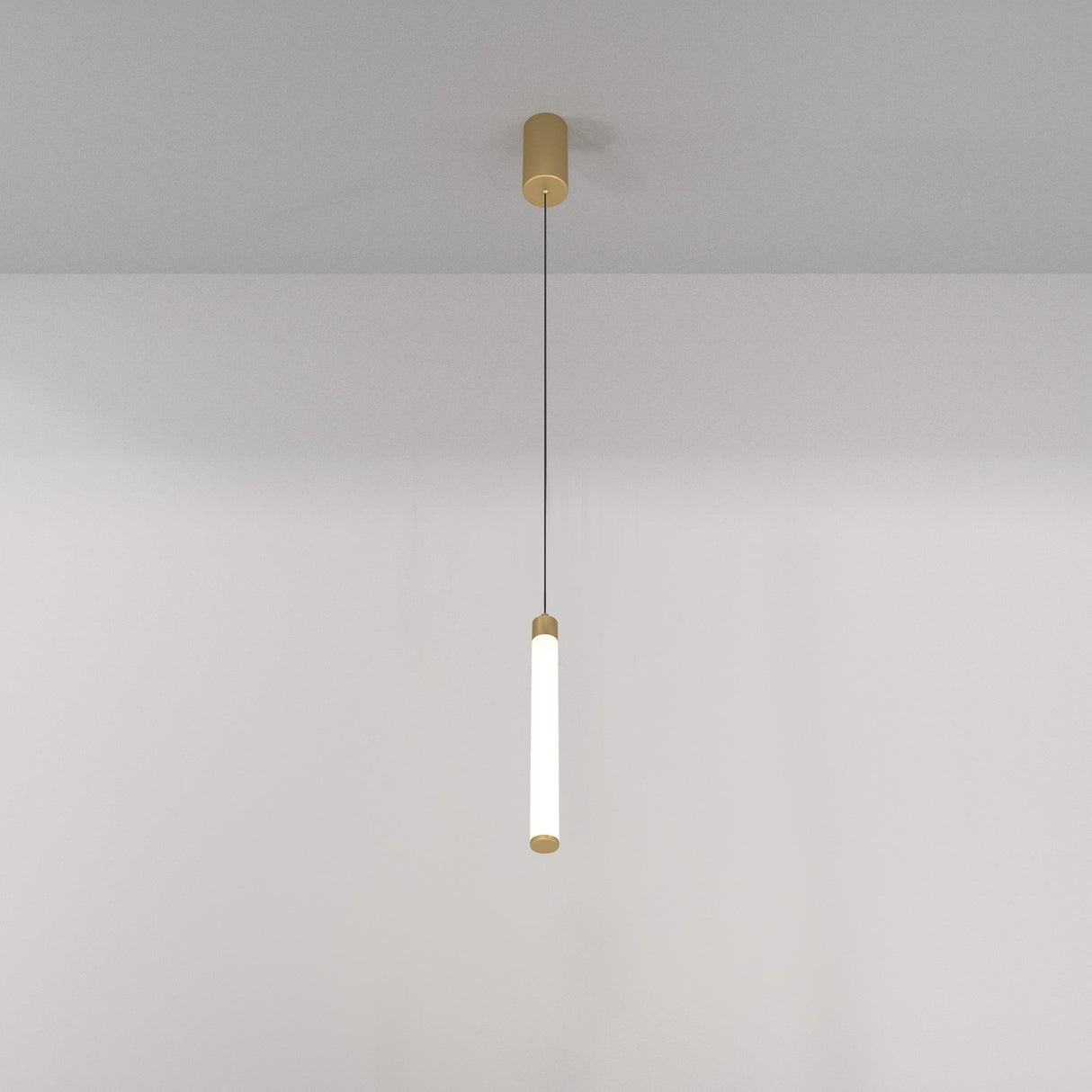 The Ray LED Short Pendant Light - Gold & White has a minimalist, long cylindrical design with a gold-colored base and tip, suspended by a thin black wire against a plain white background.