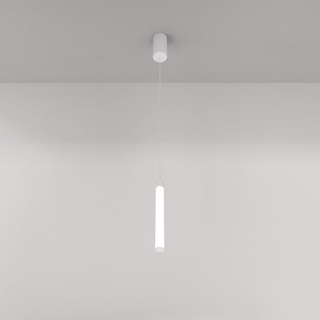 A minimalist white ceiling features the Ray LED Short Pendant Light in white, casting a soft glow. This modern interior creates a sleek ambiance against the plain background, epitomizing minimalist lighting design with its slender cylindrical form.