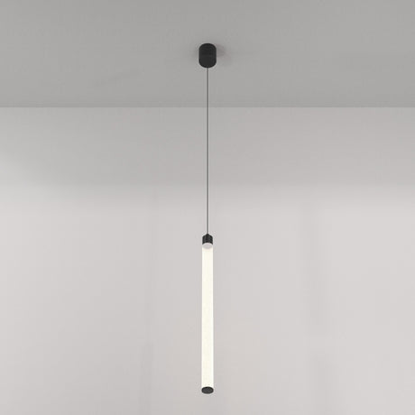 The Ray LED Long Pendant Light - Black & White is elegantly suspended by a thin wire, emitting an energy-efficient soft glow. It features black end caps and contrasts against a plain light-colored wall.