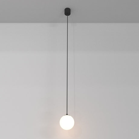 The Luna LED Globe Pendant Light (10cm, 3000K) casts a soft glow with its minimalist black cable and round bulb, offering sleek modern elegance and energy efficiency.