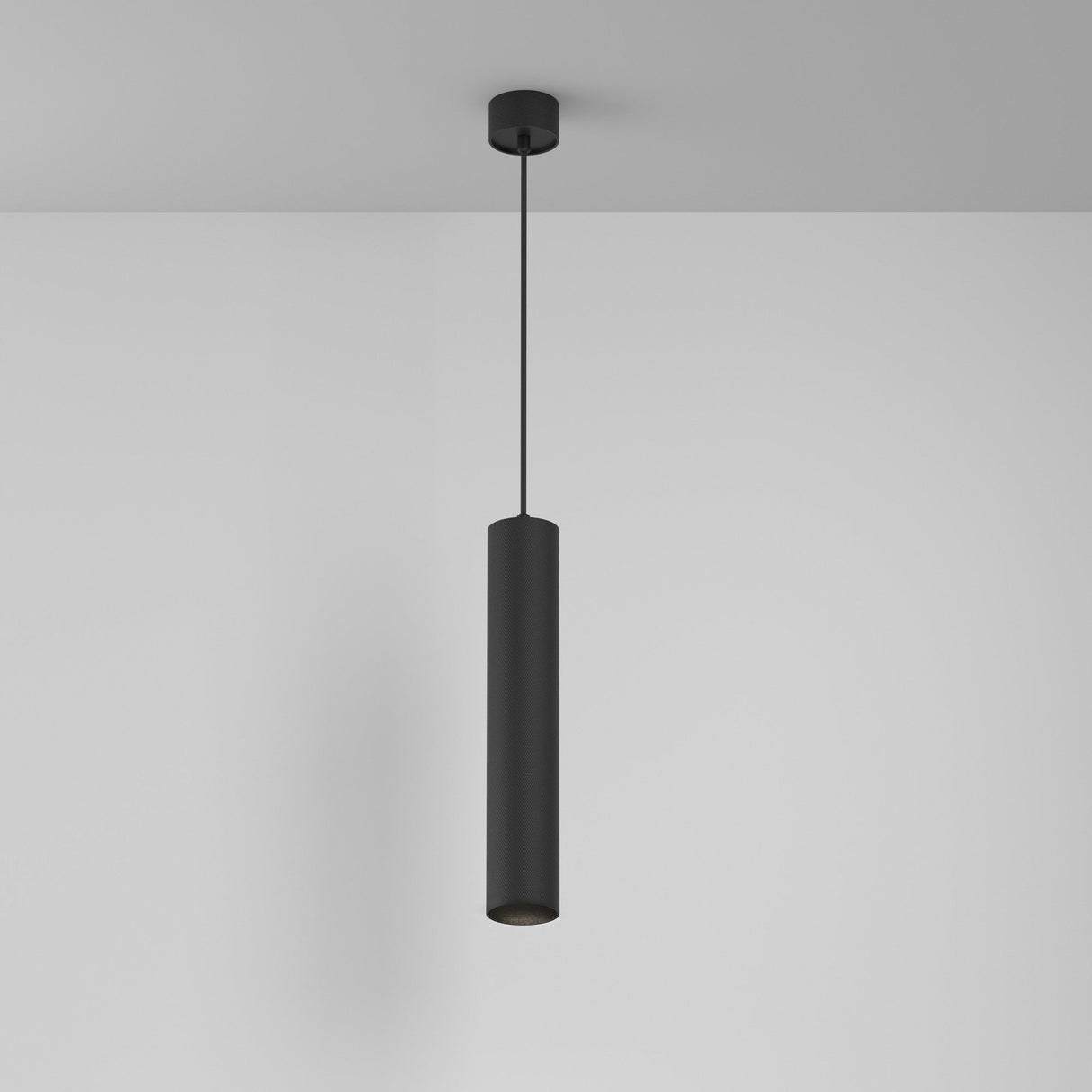 The Artisan 1 Light Long Round Pendant - Black features a sleek, black-finished design hanging elegantly from the ceiling by a thin, black cord against a plain white background, delivering a minimalist and contemporary aesthetic.