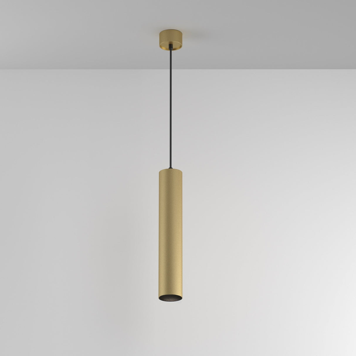 The Artisan 1 Light Long Round Pendant in matte gold features a modern adjustable design and is suspended from the ceiling by a thin black cord against a plain white background.