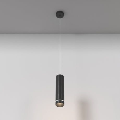 The Orlo LED Pendant Light 4000K in black features a sleek, modern cylindrical design that hangs against a plain white wall. It boasts adjustable suspension height and casts a soft downward glow, embodying minimalist elegance.