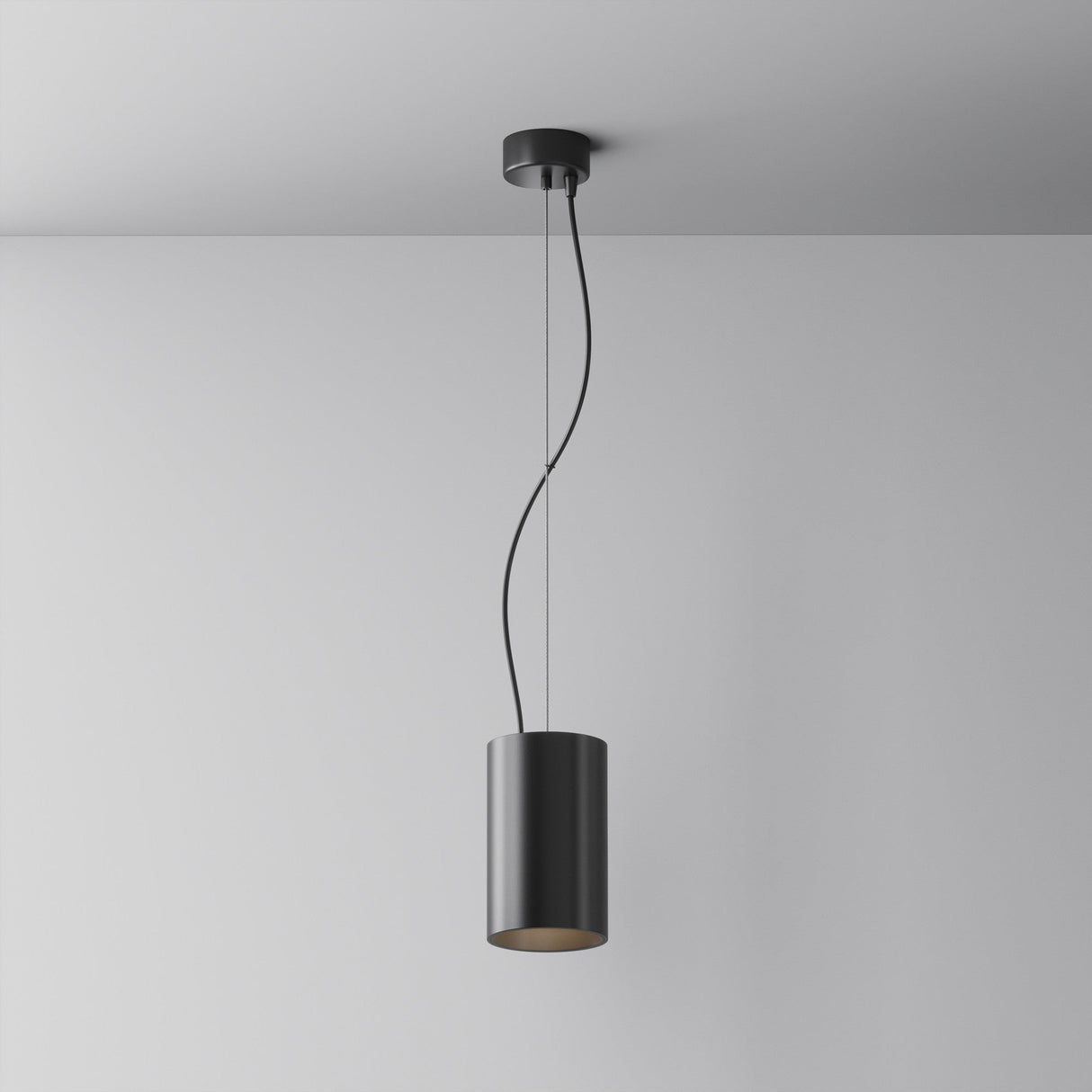 The Efir LED Pendant Light 25W - Black features a modern, minimalist design with a cylindrical shade. Suspended from a white ceiling by a thin, twisting wire, this sleek LED light highlights its contemporary appeal.