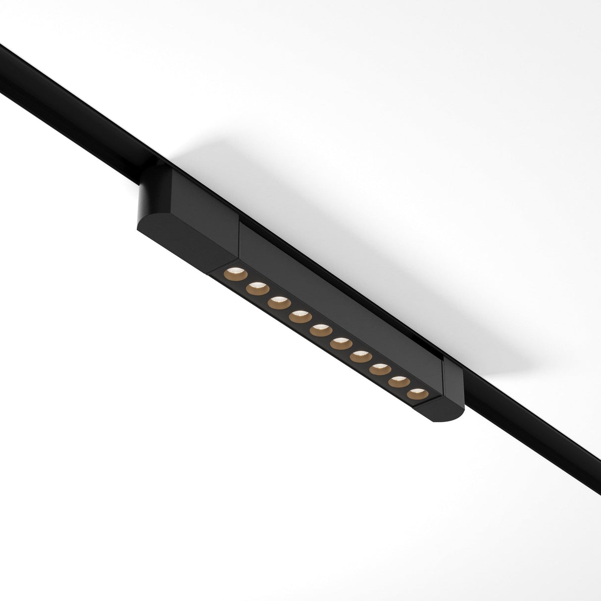 A Points Rot LED Swivel Linear Track Light for Single Phase Track Unity (10W, 4000K, 30°) in black is mounted on a white ceiling, featuring eight round LED lights aligned in a sleek rectangular casing.