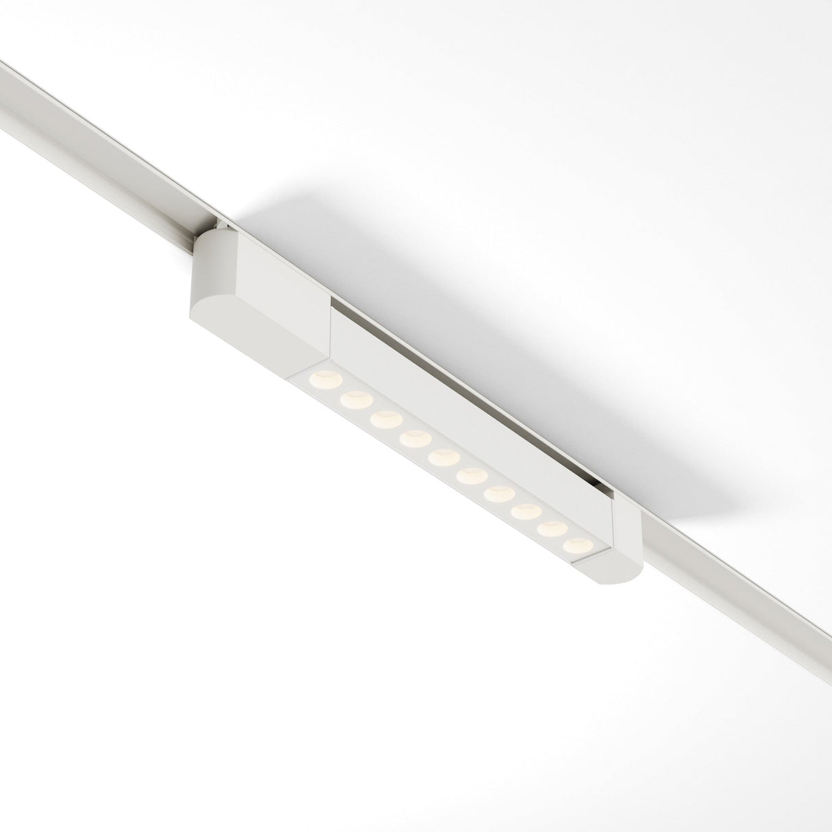 Ceiling-mounted Points Rot LED Swivel Linear Track Light features a row of nine LEDs, offering modern minimalist design and excellent task lighting. This high CRI fixture is 10W, 4000K, with a 30° angle set against a white background for single-phase track unity.