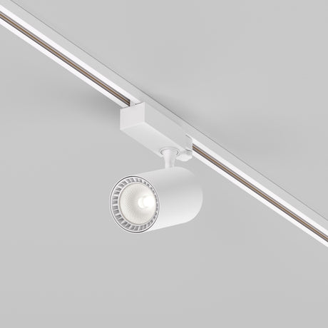 The Vuoro S 3-Circuit Trinity Track LED Spotlight, 26W, cylindrical in shape and white, emits a soft glow at 4000K, elegantly illuminating the light gray background.