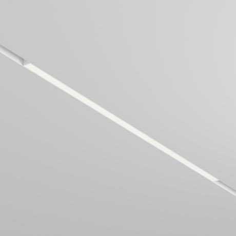 The Basis DALI CCT LED Dimmable Linear Track Light, a thin 30W strip offering 2700-6000K customizable lighting, is embedded in a white ceiling. Its minimalistic design creates a modern aesthetic and allows mood-enhancing lighting adjustments.