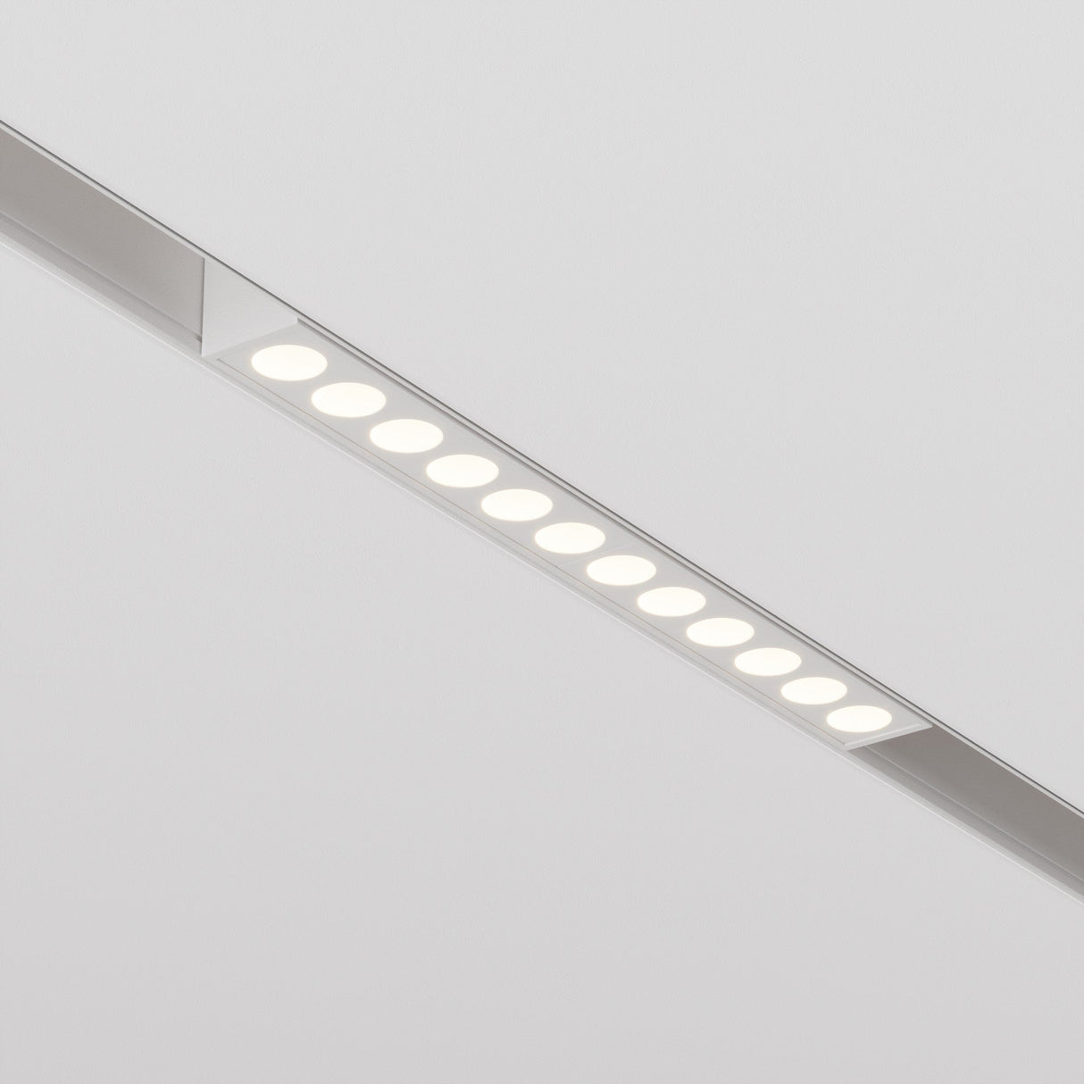 The white ceiling features the Points CCT LED Dimmable Linear Track Light, a minimalist fixture with evenly spaced small round lights in a sleek design, offering adaptable color temperature from 2700K to 6000K for the perfect ambiance.