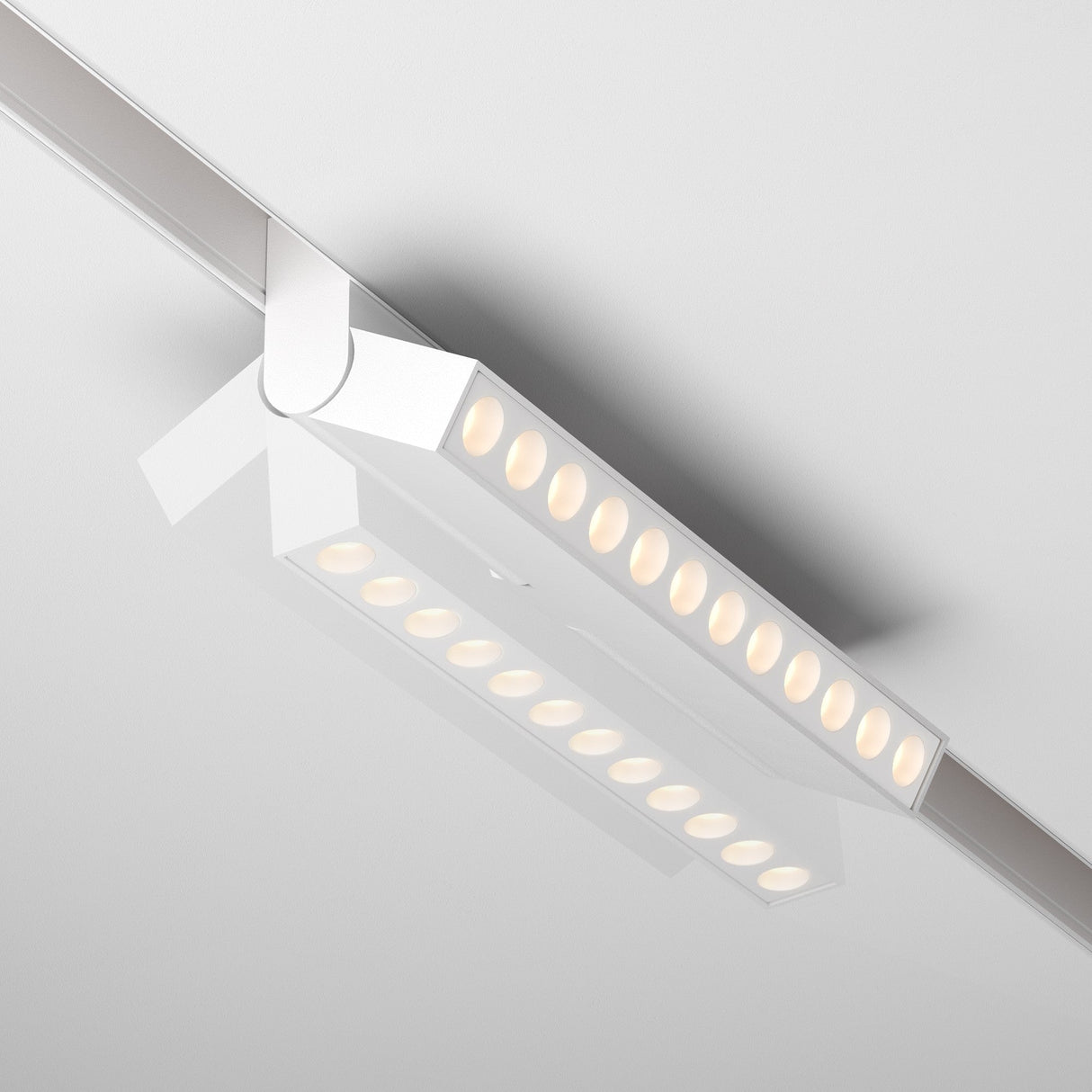 The Points Rot DALI CCT LED 12W light, an adjustable linear track fixture in white, offers a dimmable design with recessed circular LEDs and color temperature range from 2700-6000K, providing soft and even illumination.