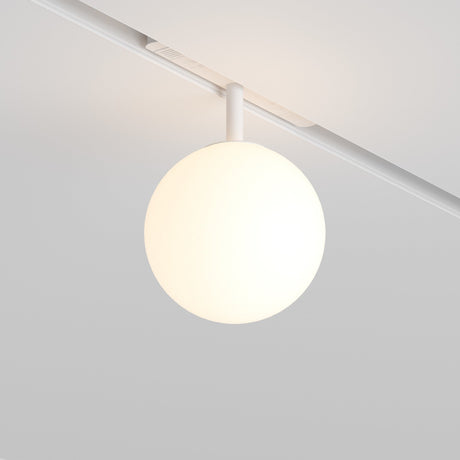 The Luna LED Magnetic Exility Track Globe Ceiling Light (5W, 3000K, White) emits a soft, warm glow and is mounted on an LED magnetic track on a smooth white ceiling, offering a minimalist and contemporary ambiance ideal for modern interiors.
