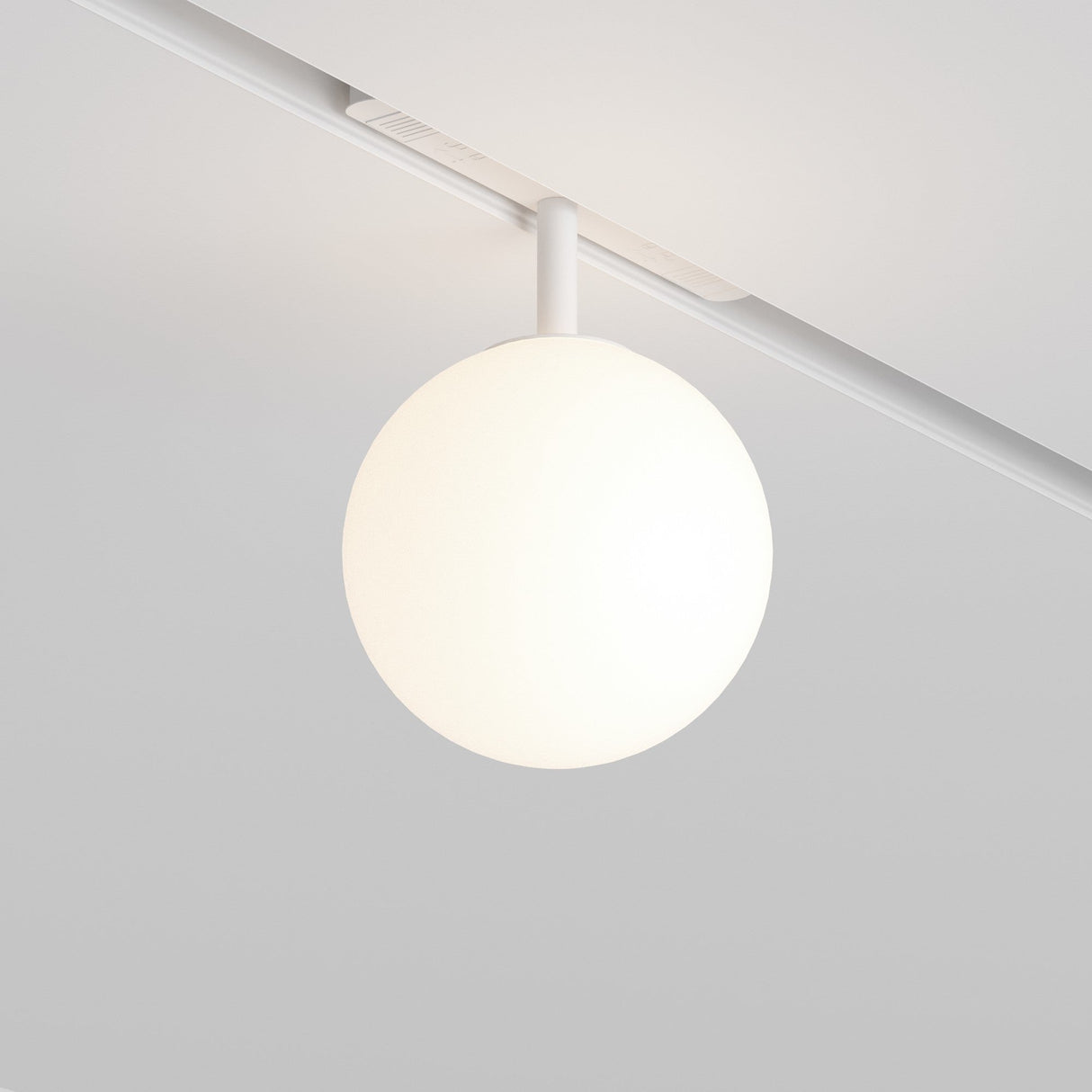 The Luna LED Magnetic Exility Track Globe Ceiling Light 5W 4000K - White offers a modern lighting solution with a sleek design. Its a spherical white globe hanging from a magnetic track, providing soft illumination and minimalist charm.