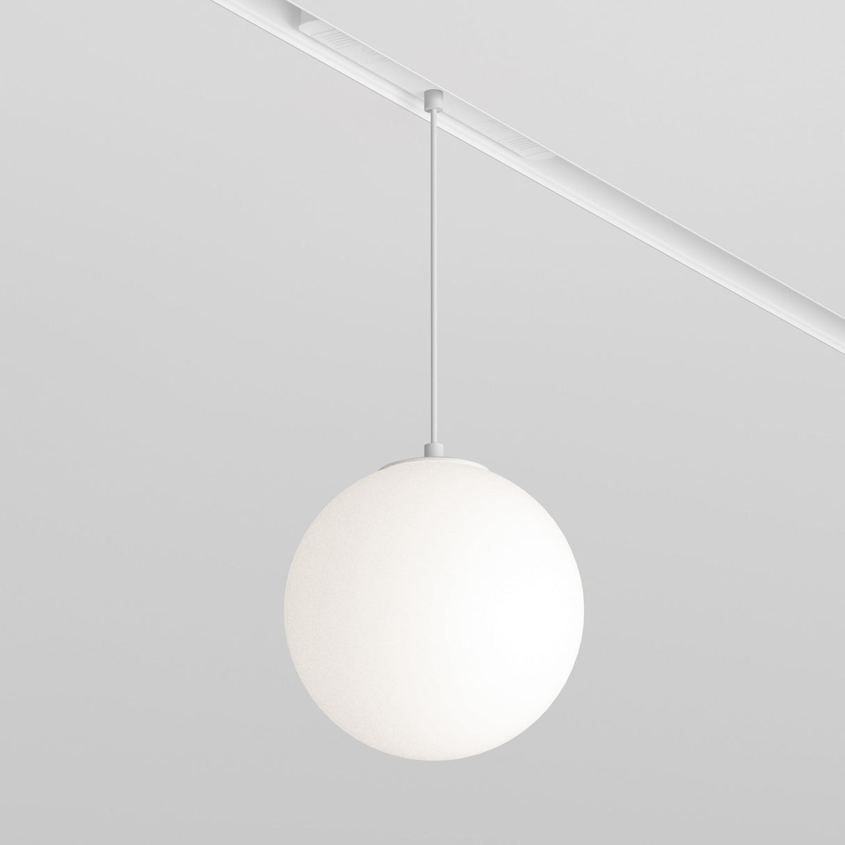 The Luna LED CCT Dimmable Smart Magnetic Exility Track Pendant Light 5W 3000-6000K features a white spherical shade gracefully suspended from a magnetic track, showcasing a minimalist design that blends simplicity and elegance with smart dimmable lighting against a plain white backdrop.