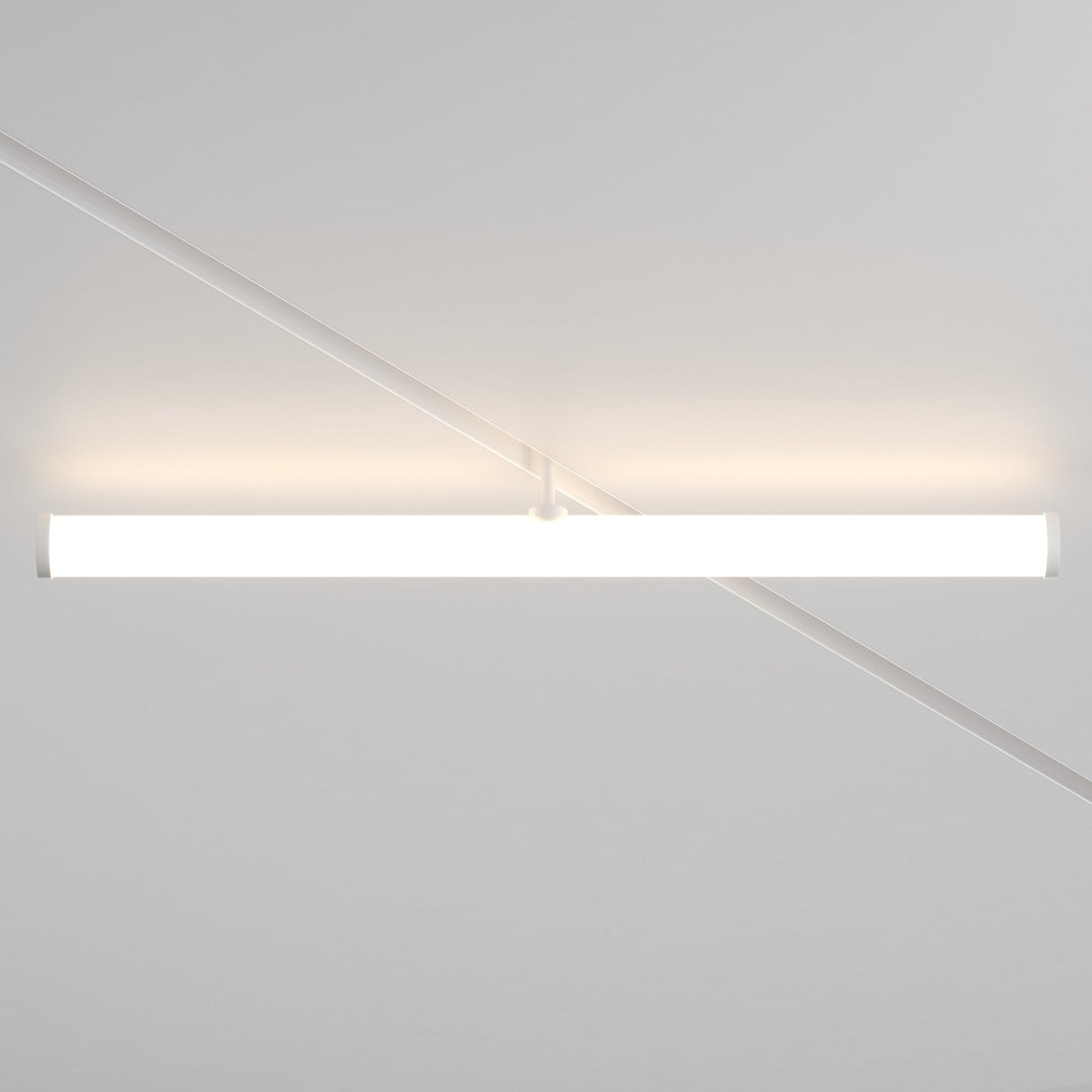 The Larc LED Rotating Linear Track Light, 25W 4000K in white, features a sleek horizontal tube design with energy-efficient LED technology. It is set against a subtly patterned white ceiling and casts a soft glow on the surrounding surface.