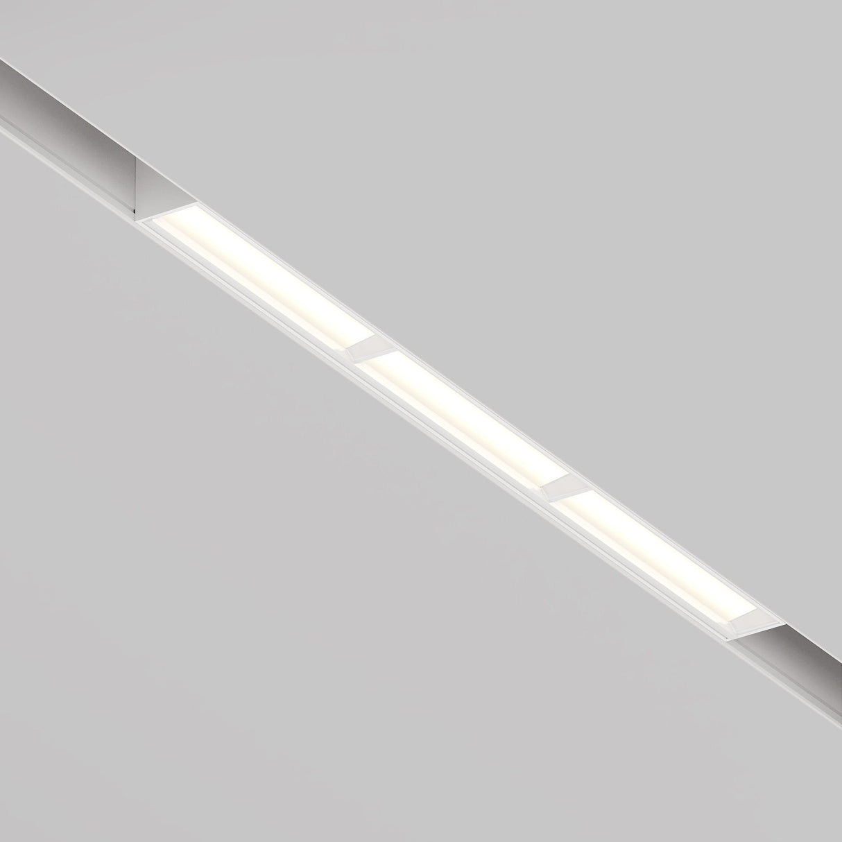The Parete CCT LED Dimmable Linear Track Light, designed for magnetic Exility, features a sleek and modern elongated style with 18W LEDs. It offers adjustable color temperatures from 2700K to 6000K in a minimalist white background for a contemporary ambiance.