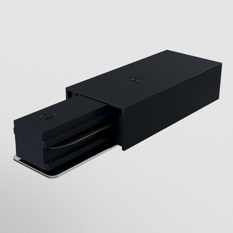 A black wall-mounted light fixture with a rectangular box design features the Unity Single Phase Track Power Feed. An extendable section is partially exposed, revealing the light source against a plain white background, exuding modern elegance.