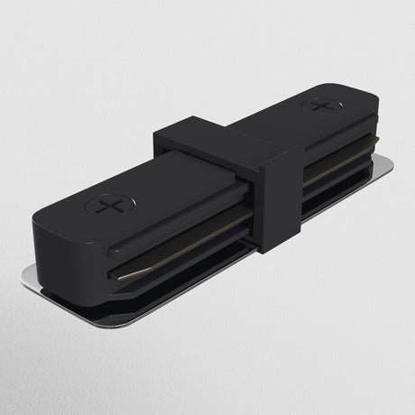 The Unity Single Phase Surface-Mounted Track Straight Connector in black boasts a sleek, modern design with a minimalist look, connected by a central pivot. It mounts on a reflective metallic base with visible screws for installation.