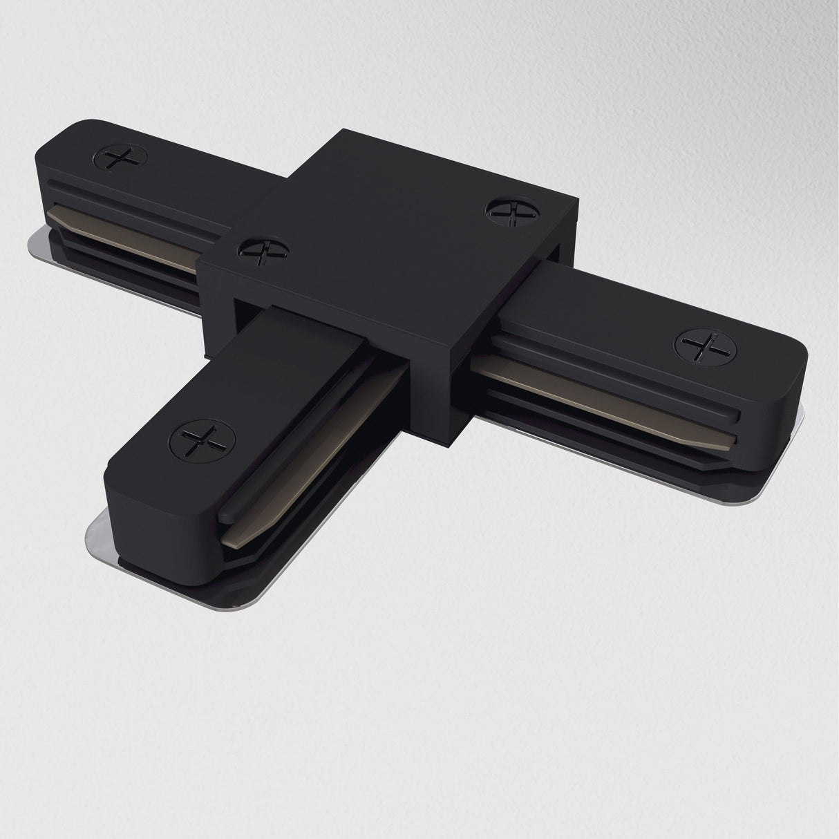 Unity Single Phase Surface-Mounted Track T-Connector in black, featuring four screw holes, is designed for single-phase track lighting systems and is set against a light grey background.