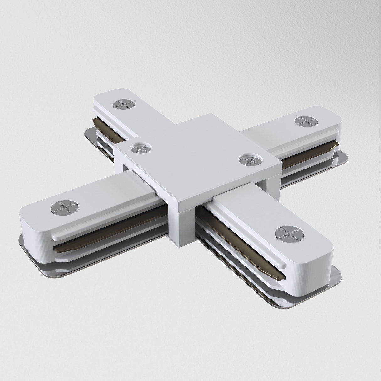 The Unity Single Phase Surface-Mounted Track X-Connector in white lies flat on a white surface, featuring three segments extending outward, a central square part, and metallic screws, highlighting its industrial design.