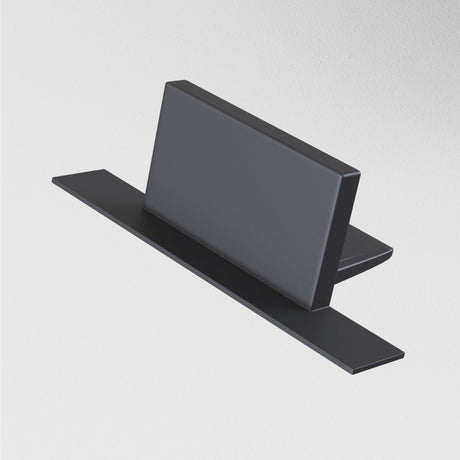 A sleek, black rectangular object with a central flat panel and two side panels resembles a modern lighting system. Its minimalist design hints at the Unity Tracks Single Phase Track End Cap - Black, all set against a plain white background.