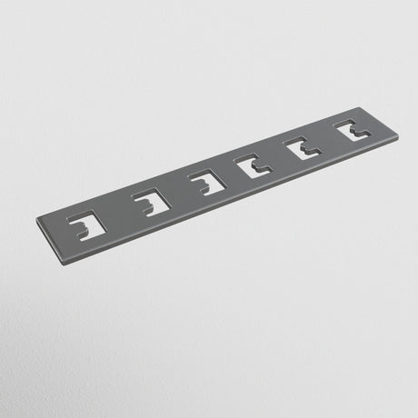 The S35 Tracks Recessed Straight Connector in gray metal features five evenly spaced, slightly curved rectangular cutouts, resembling a Linear Track Lighting component, and is set against a white background similar to parts of a magnetic track system.