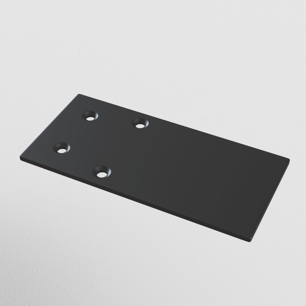 The S35 Magnetic Surface-Mounted Track End Cap - Black, a durable aluminum plate with four holes (two per side), rests on a light gray background. It has a smooth, shiny finish with elegantly rounded edges.