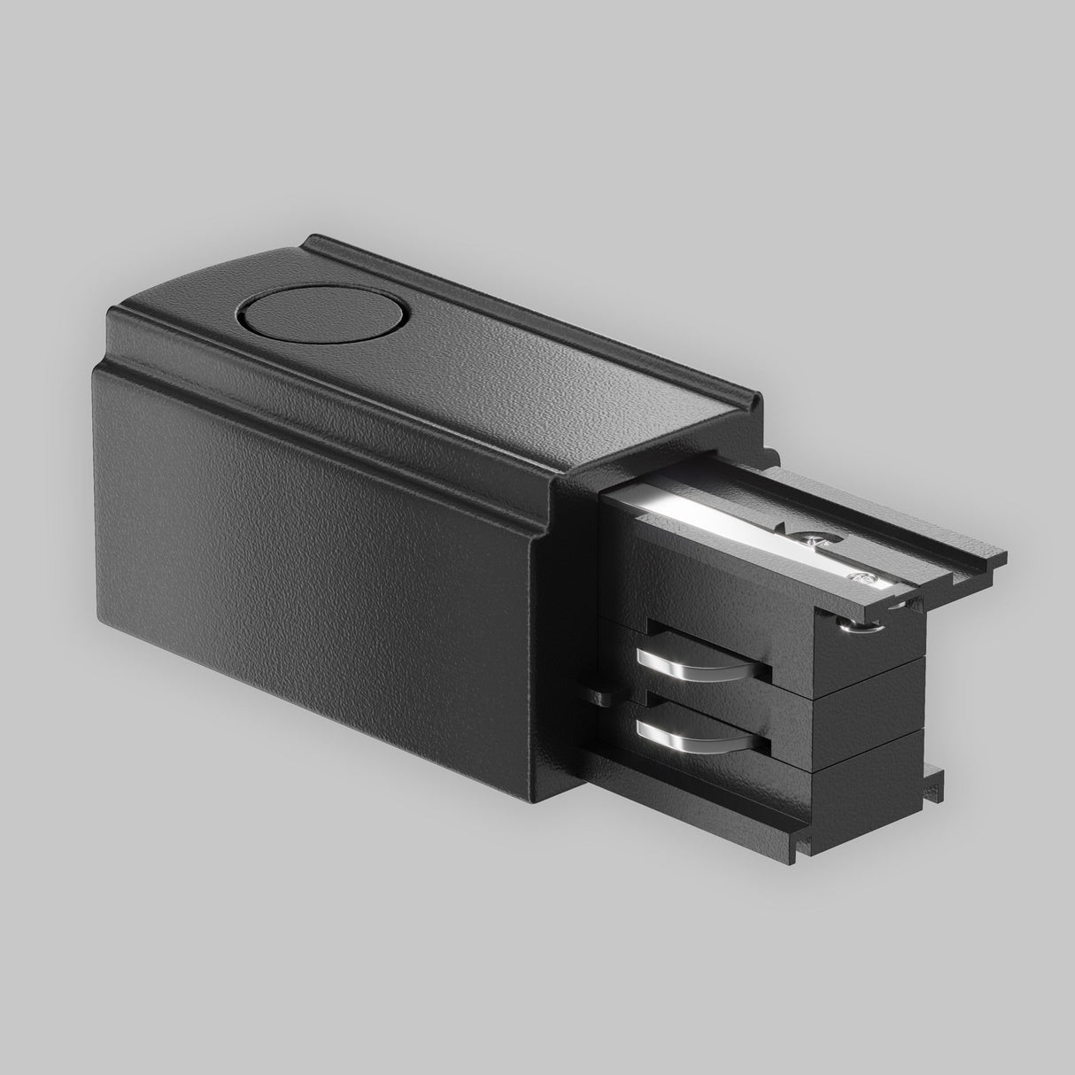 Image of a 3-Phase Track Trinity Left Power Input - Black against a light gray background. The sleek rectangular design, with a small circular indentation and visible metal pieces extending from one end, is ideal for three-phase track lighting systems.