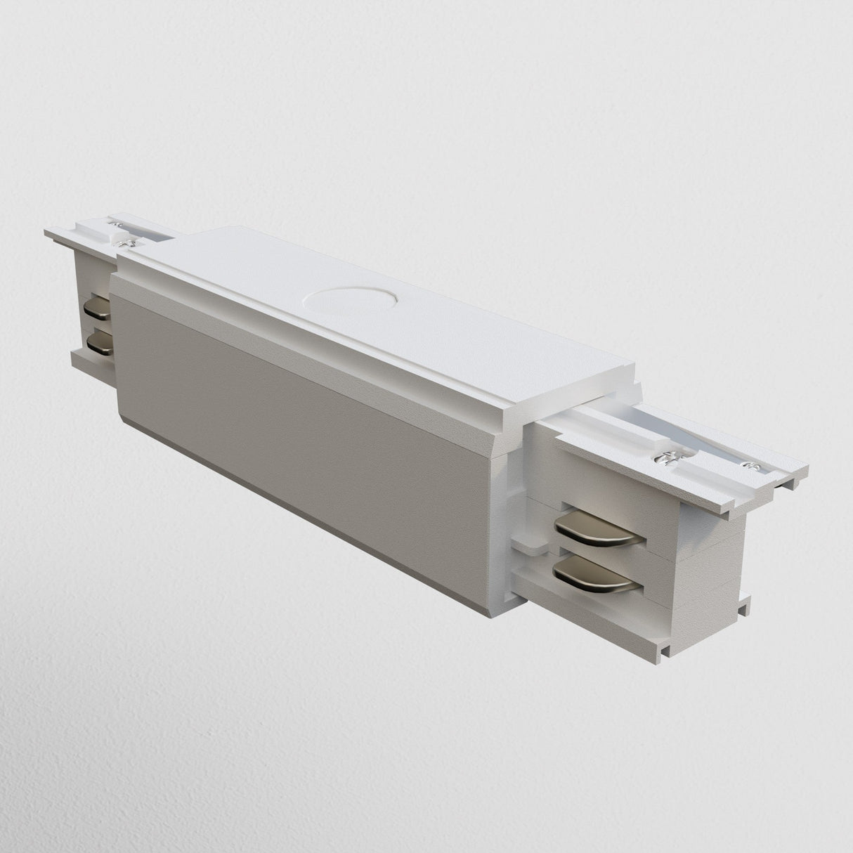 The 3-Phase Surface-Mounted Track Trinity Straight Connector in white is a rectangular electrical component featuring metal parts and channels on both ends, seamlessly integrating into three-phase track systems with a smooth surface, slight indentations, and a circular marking for diverse lighting setups.